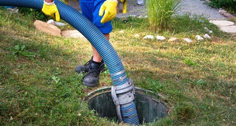 Cleaning sludge from septic system