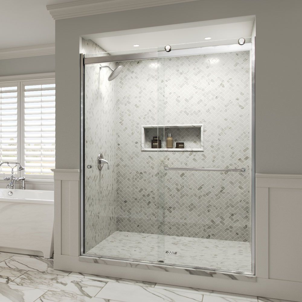 Modern white marble walk-in shower with glass surround, recessed shelf, and chrome fixtures in a bathroom