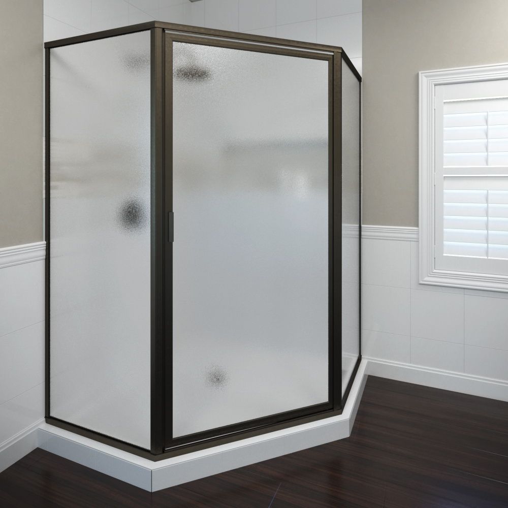 Frameless glass shower enclosure with black trim in a bathroom corner.