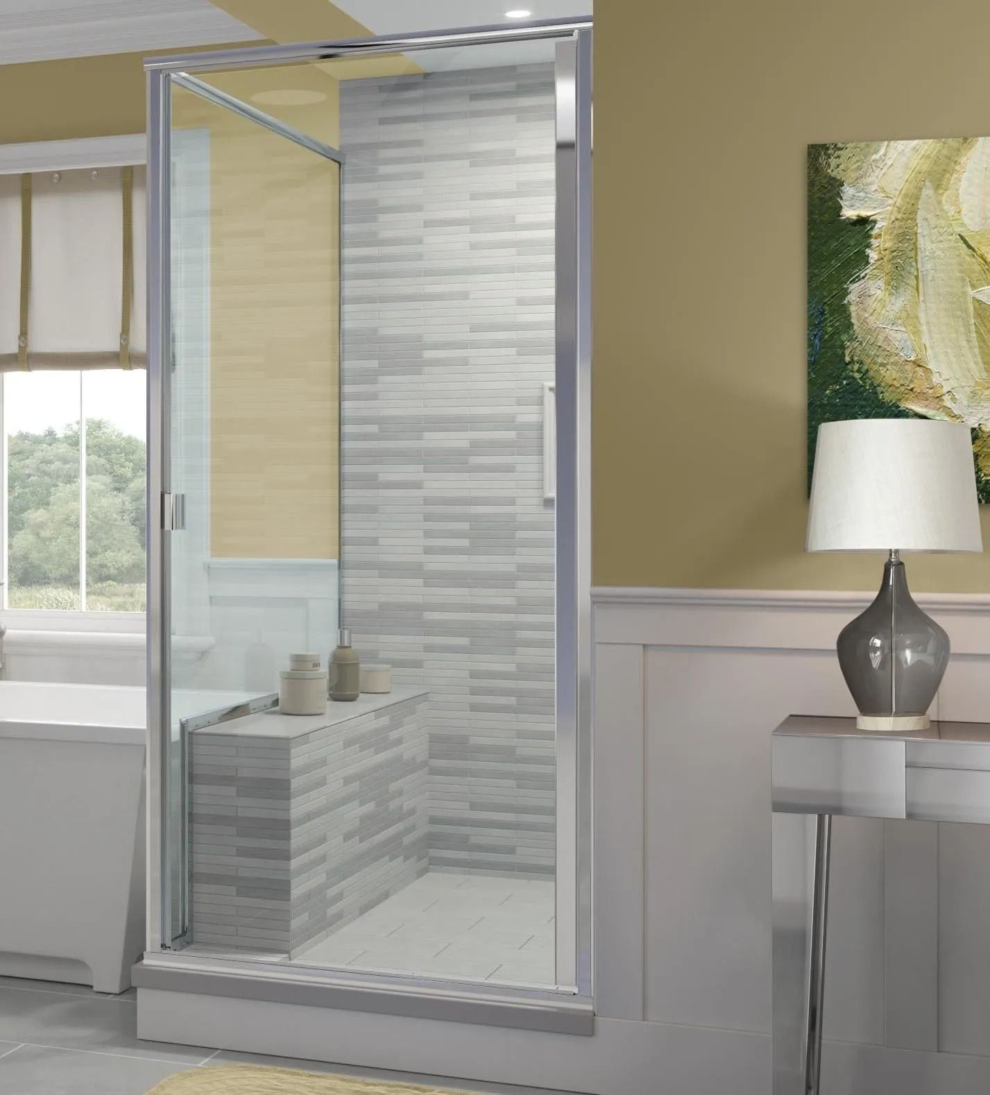 A glass shower enclosure with a tiled built-in bench, set in a neutral-toned bathroom with a table lamp nearby.