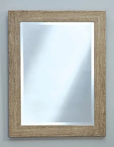 A rectangular wall mirror with a textured, light brown wood-grain frame against a neutral grey background.