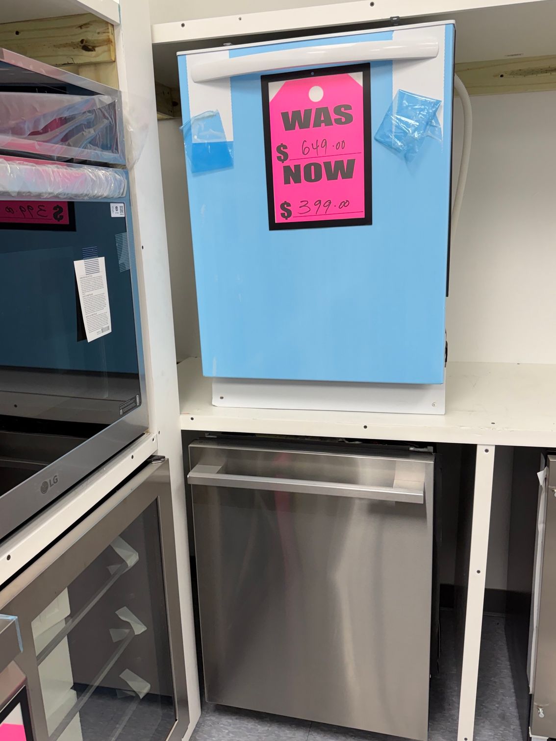 Light blue refrigerator with a pink 