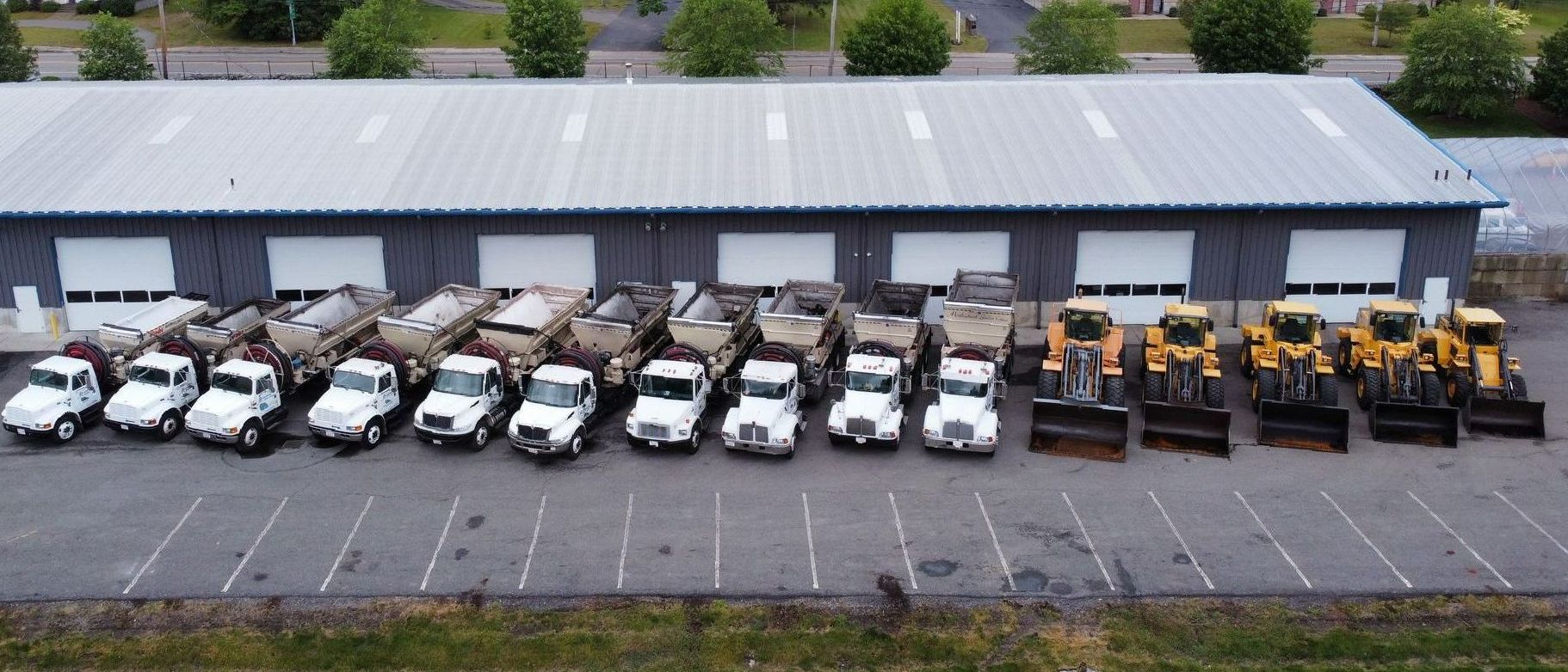 fleet of material blow trucks, hanson ma mulch installers, driveway sealcoating experts