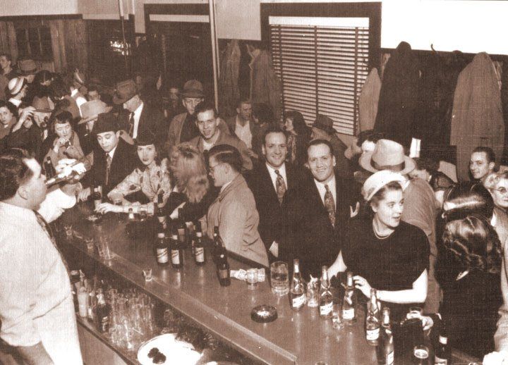 Old photo of  people in a restaurant