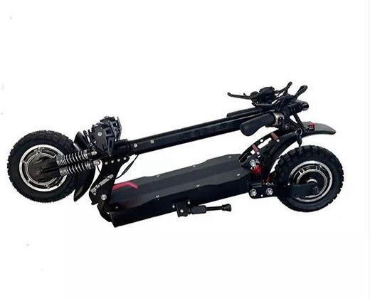 A black electric scooter is folded up on a white background.
