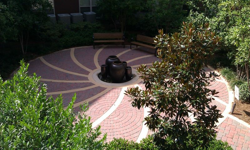 a brick labyrinth with a fountain in the middle