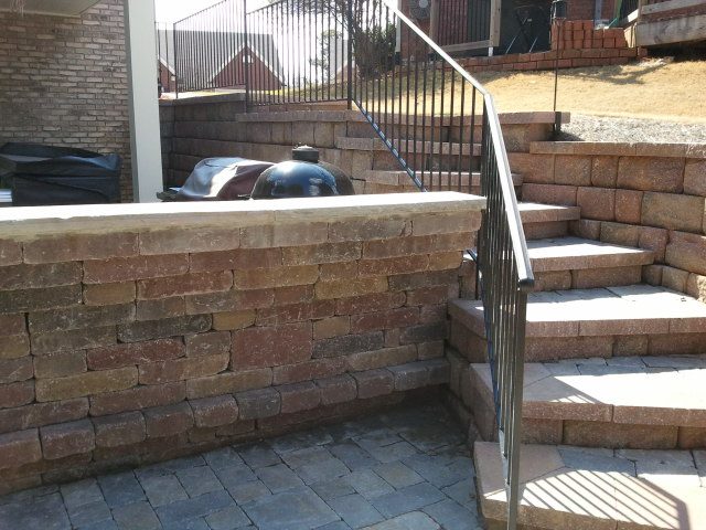 a brick wall with stairs leading up to it