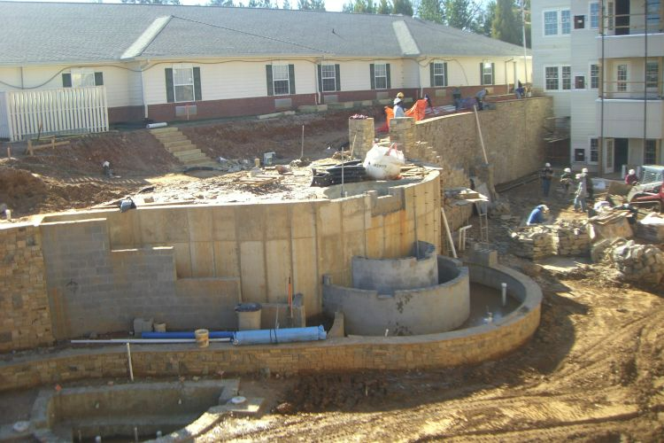 a construction site with a building in the background