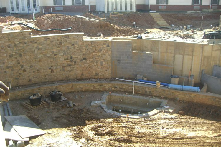 a construction site with a building in the background