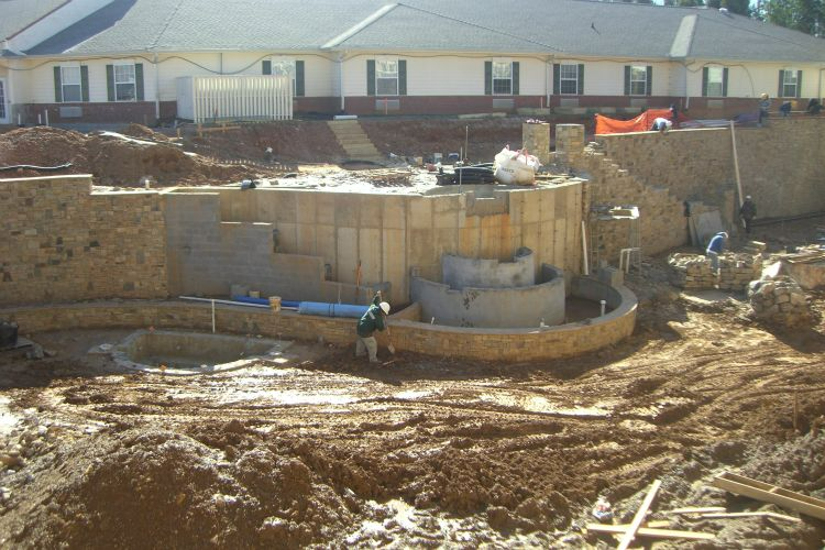 a construction site with a building in the background