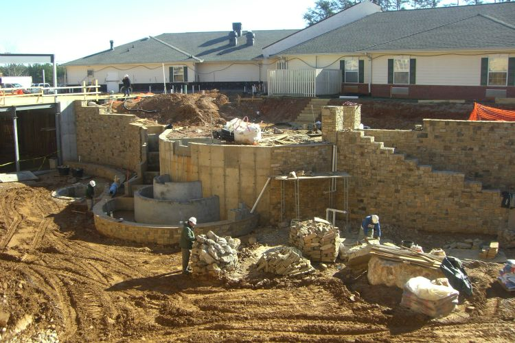 a construction site with a house in the background