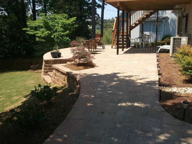 a house with a patio and stairs in the backyard