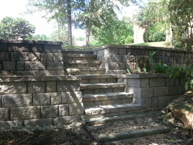 a stone wall with stairs leading up to it