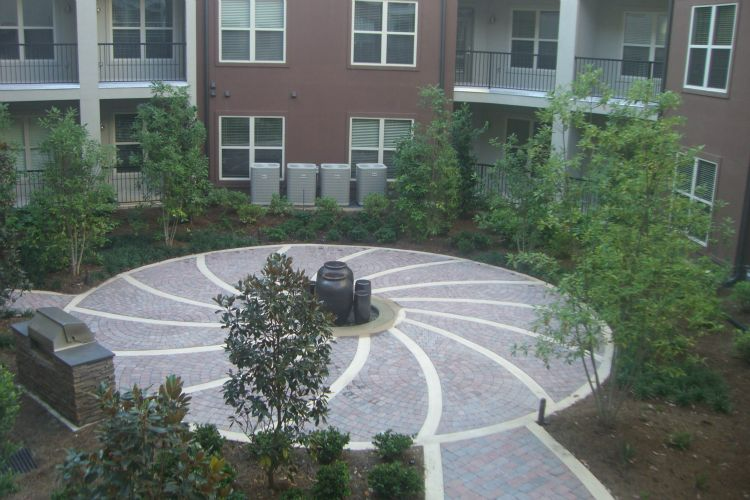 a large building with a circular driveway in the middle of it
