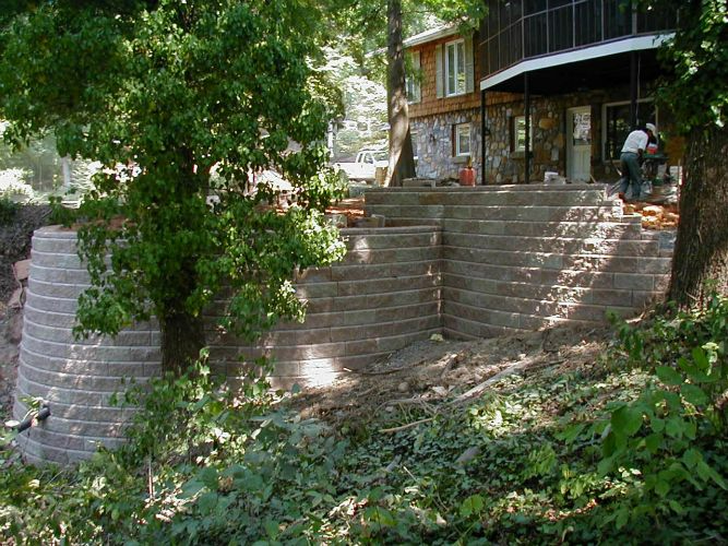 a brick wall is being built in front of a house .