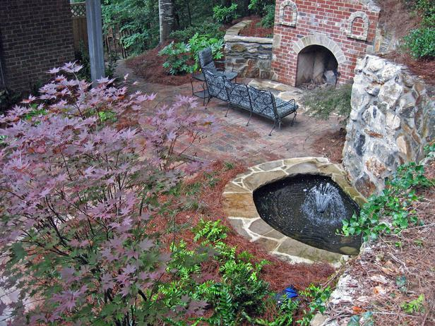 there is a fountain in the middle of the garden .