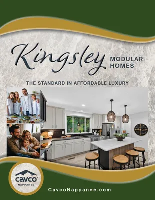 Kingsley Modular Homes ad with kitchen interior, family photos, green and gold border, Cavco logo