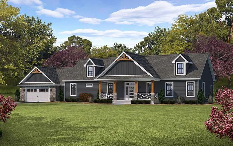Gray suburban house with white trim, front porch, garage, and a large green lawn under a blue sky
