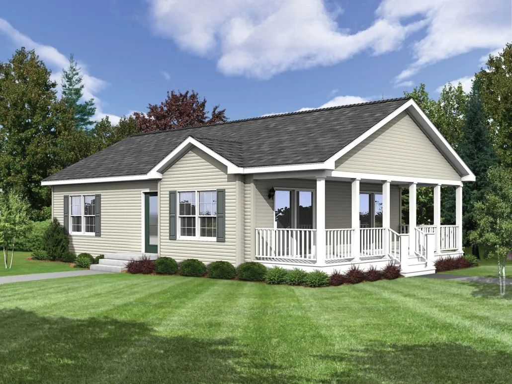 Single-story beige house with white porch and green lawn under a blue sky