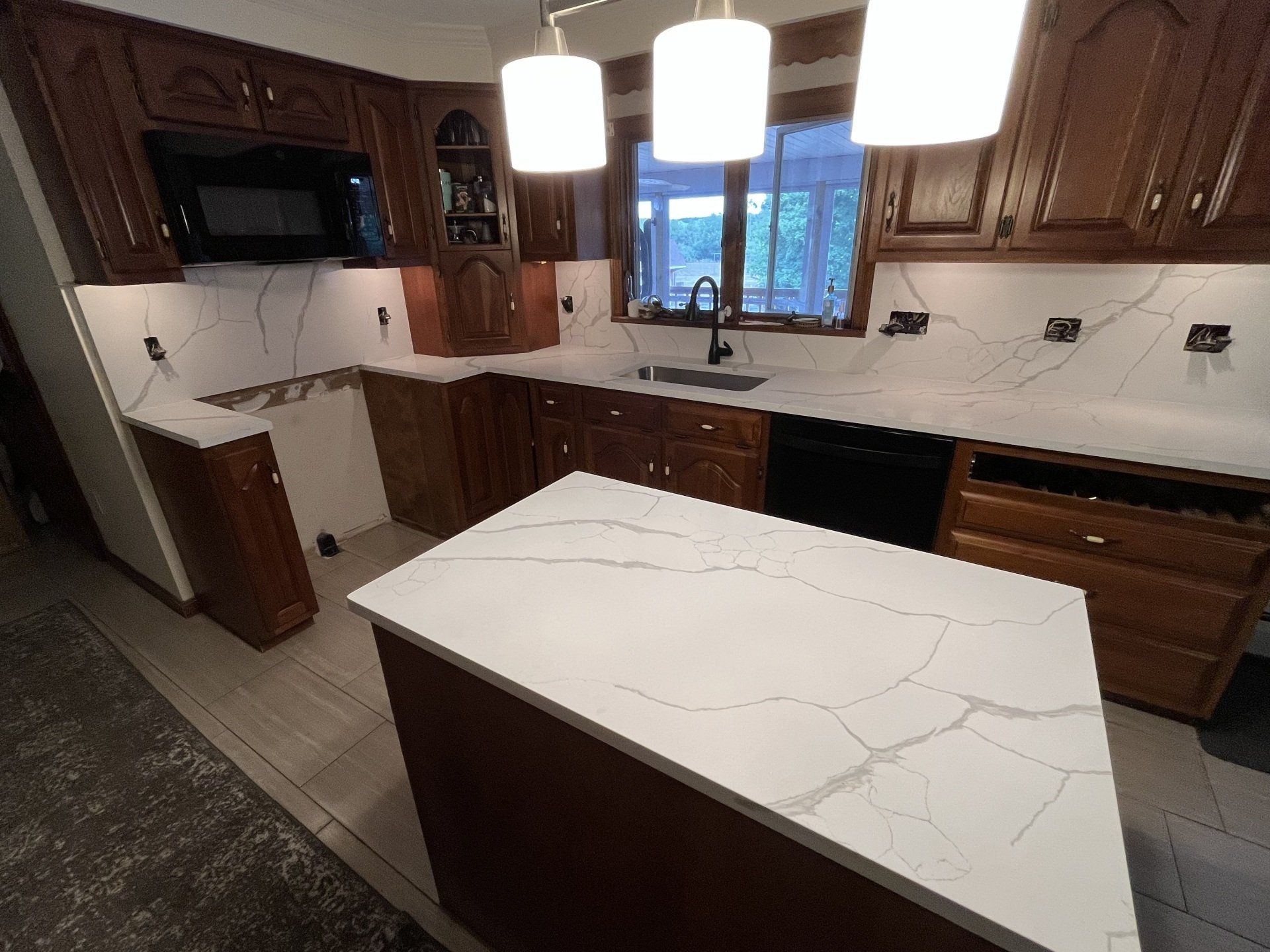 There is a large island in the middle of the kitchen