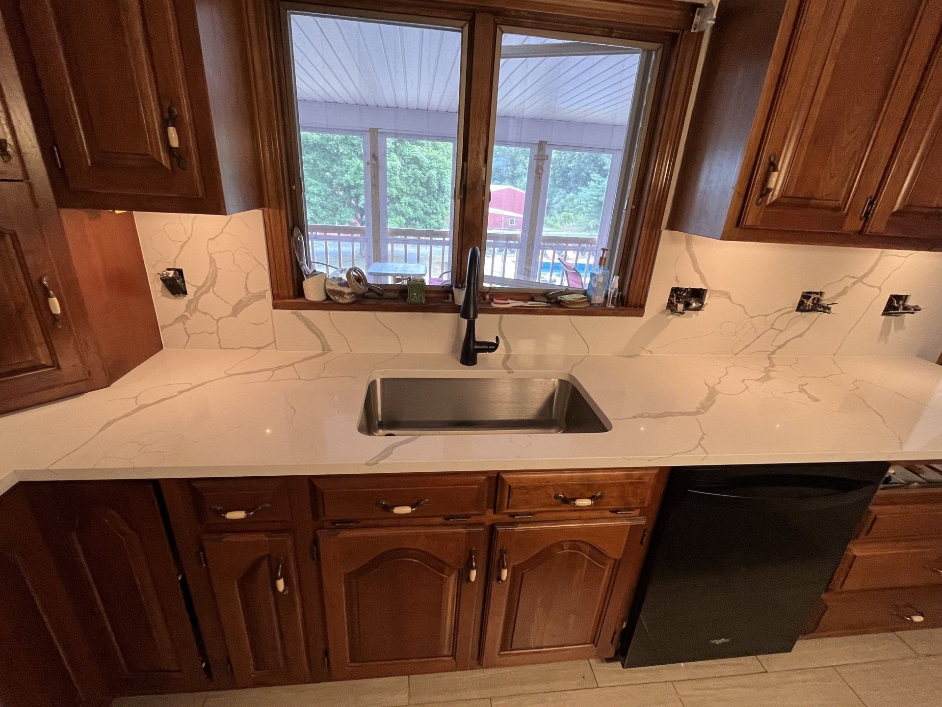 Kitchen with black faucet