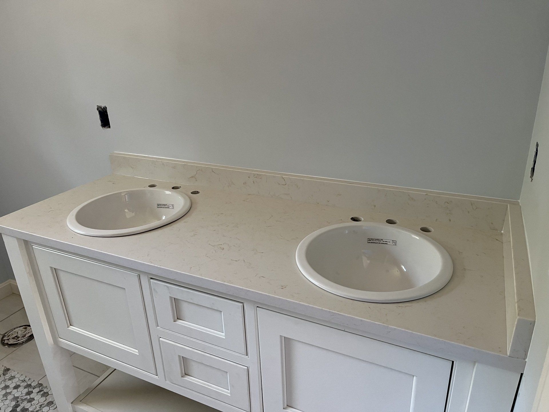 A kitchen with a white countertop and a black stove top oven
