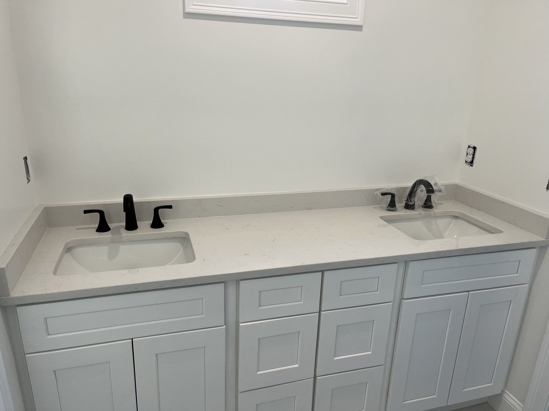 Modern bathroom sink with black faucets