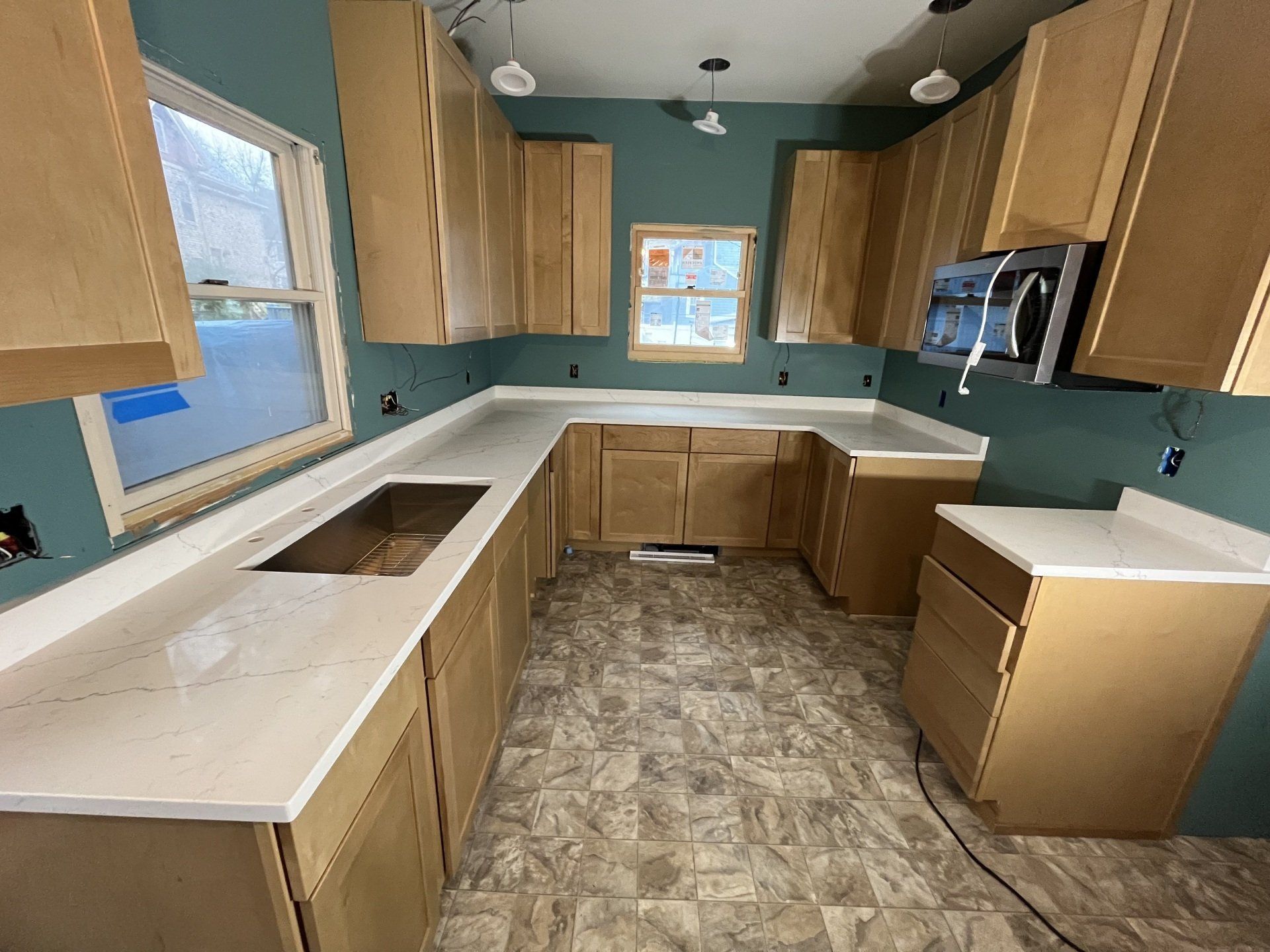 New kitchen with blue-green walls