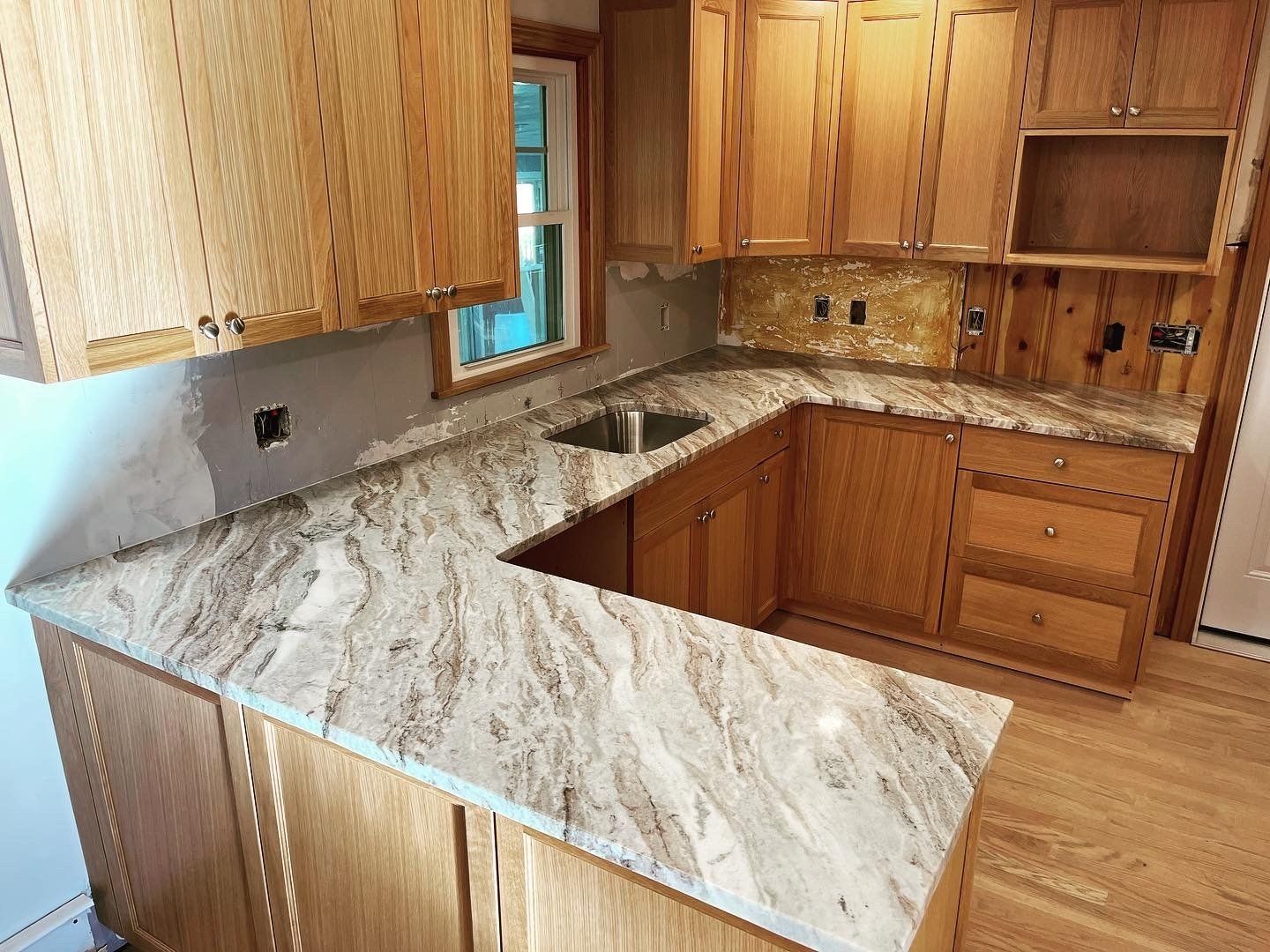 Kitchen with unfinished wall painting