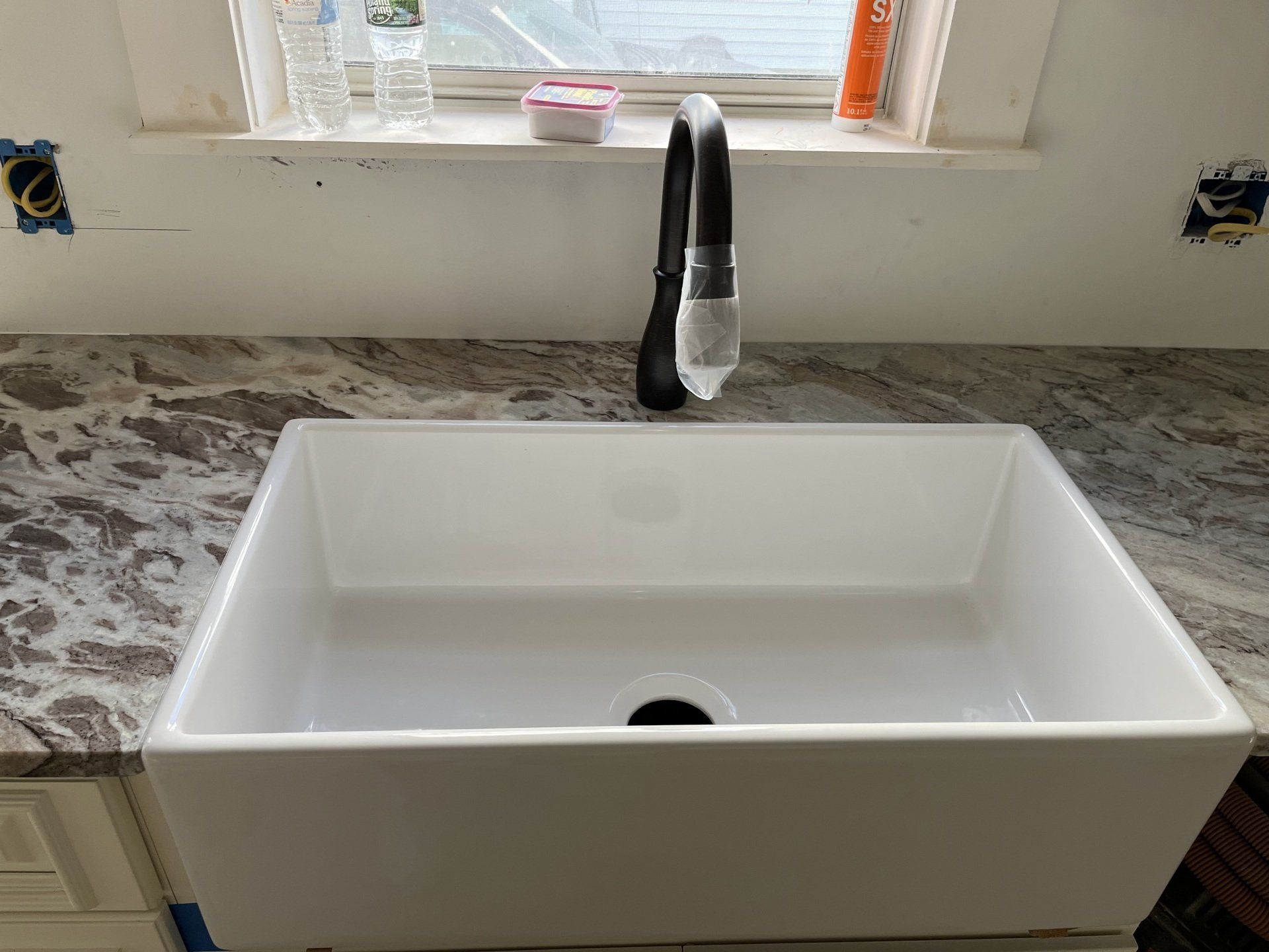 New faucet covered in plastic