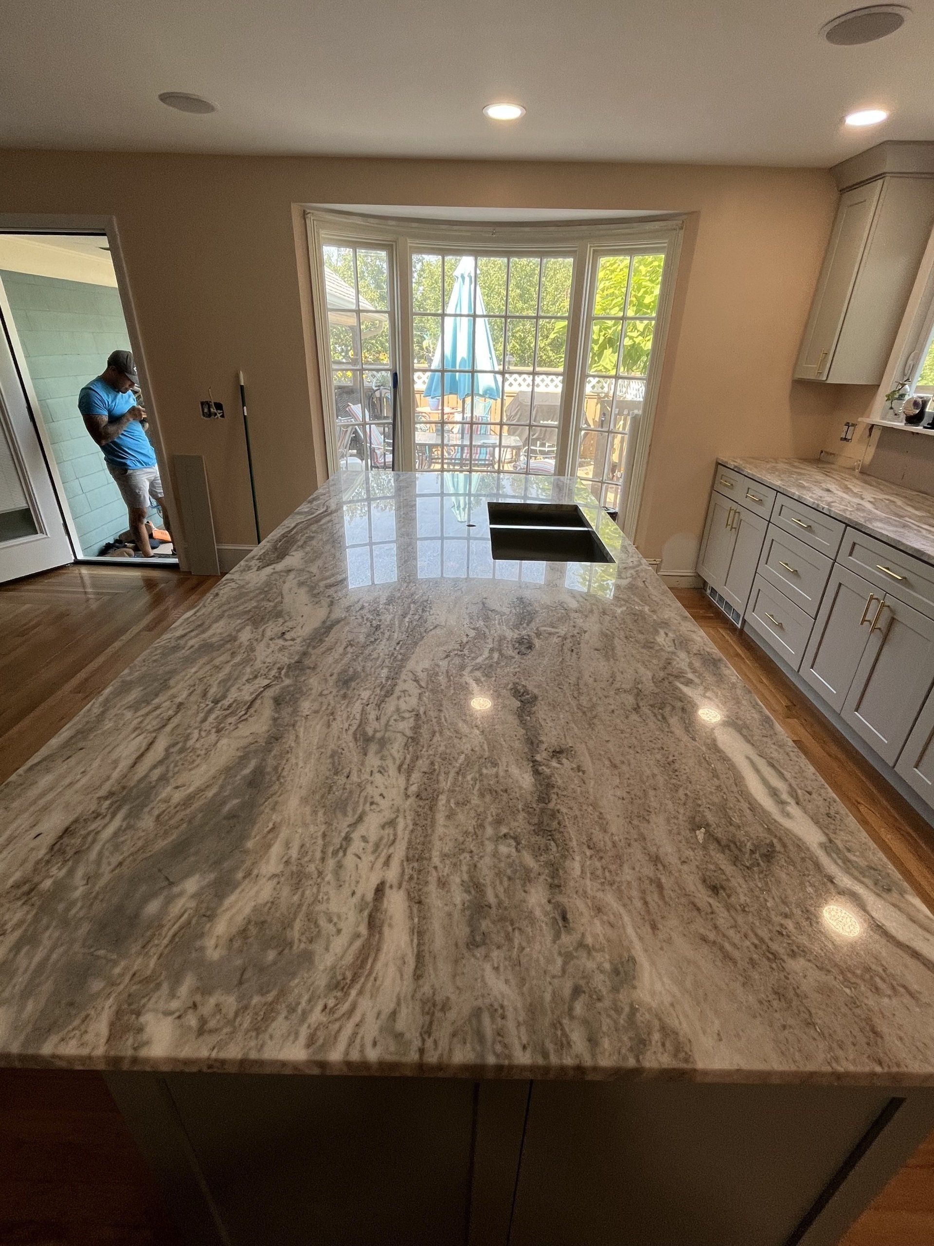 Side view of a kitchen island with a marble countertop