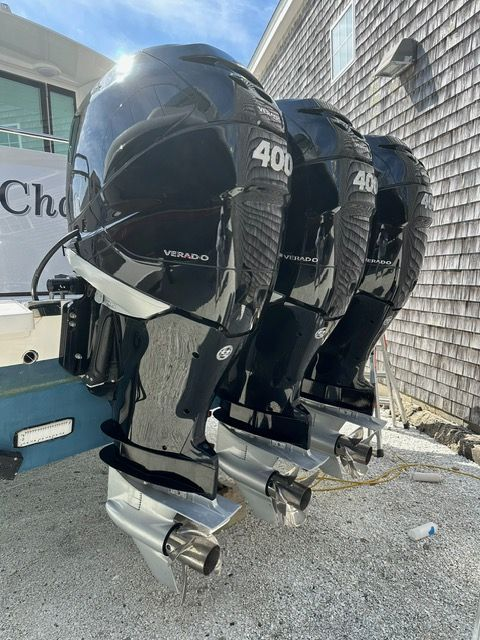 Three black outboard boat motors with 