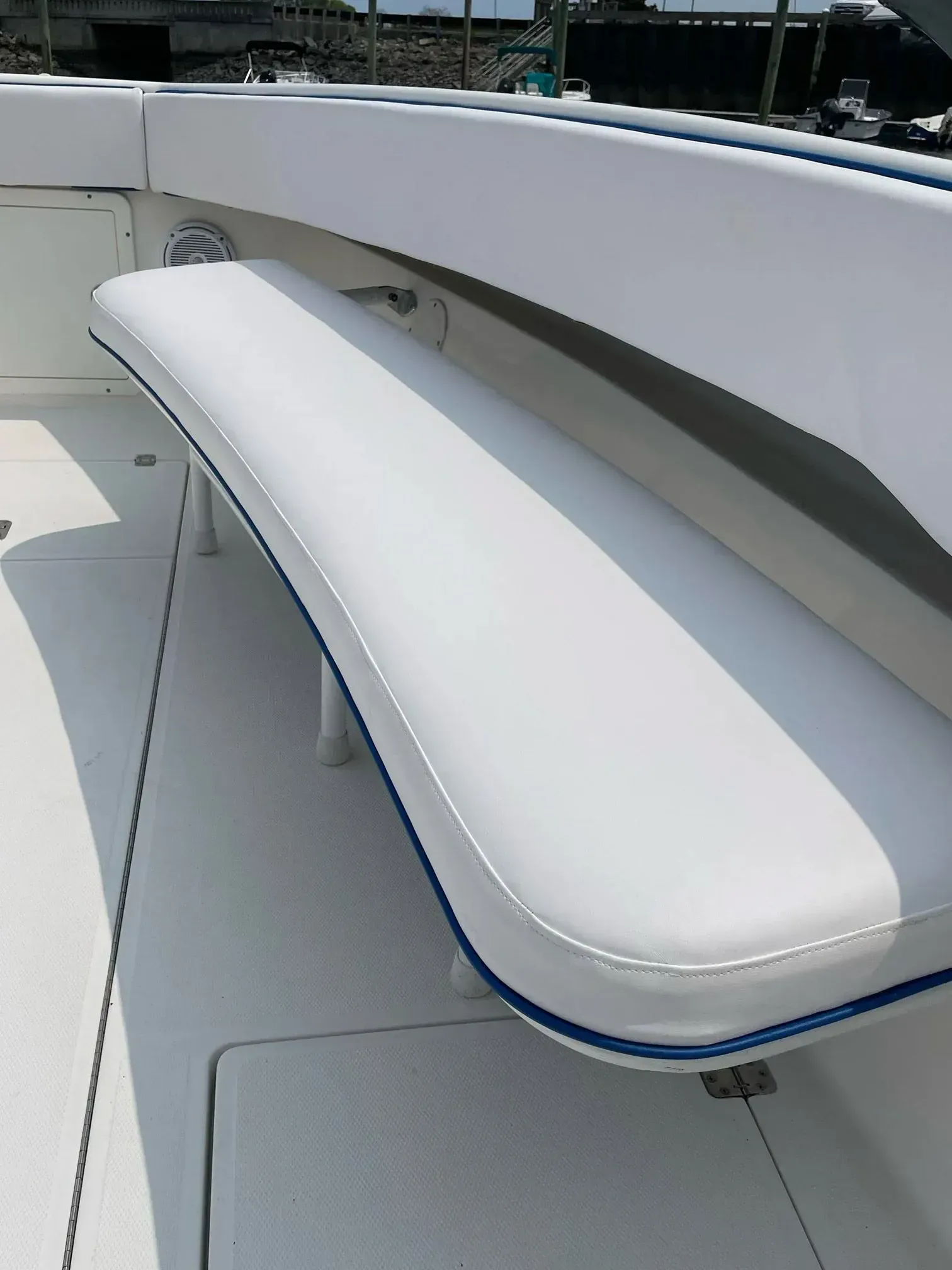 White boat bench with blue trim.