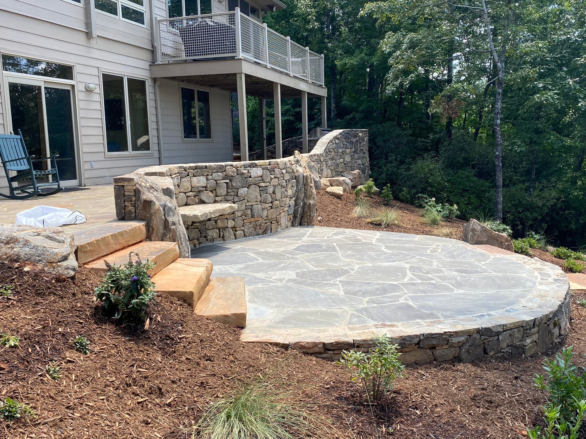 A large house with a large patio in front of it.