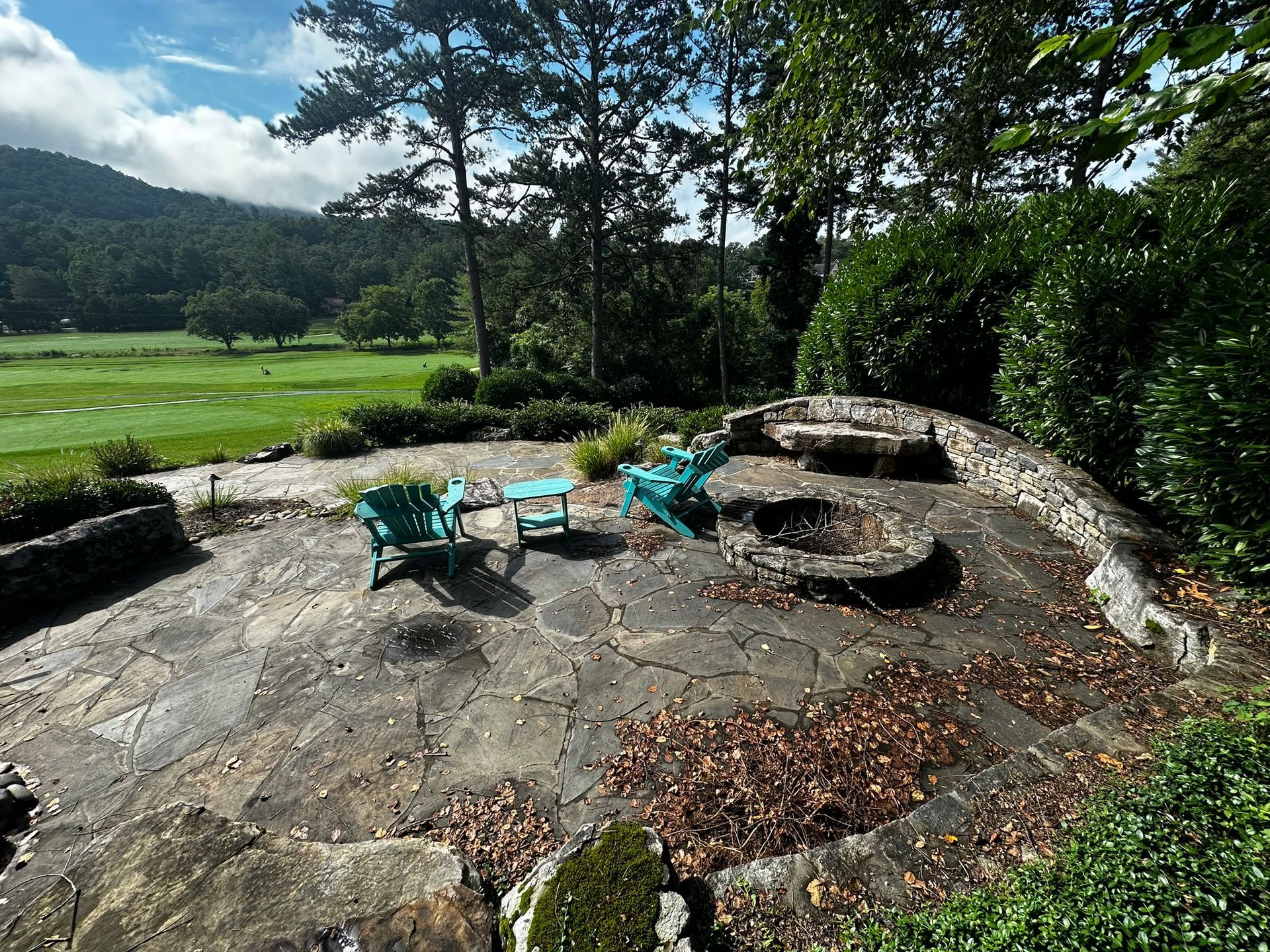 There is a fire pit in the middle of the patio.