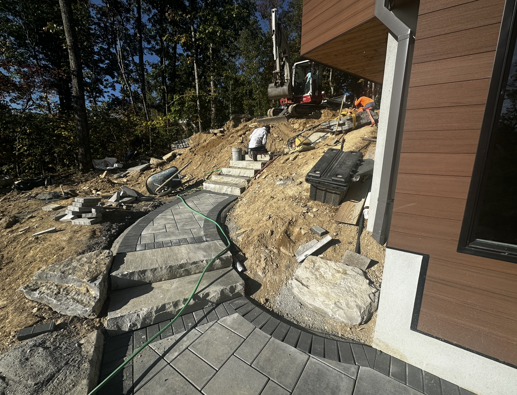 A staircase is being built in front of a house.