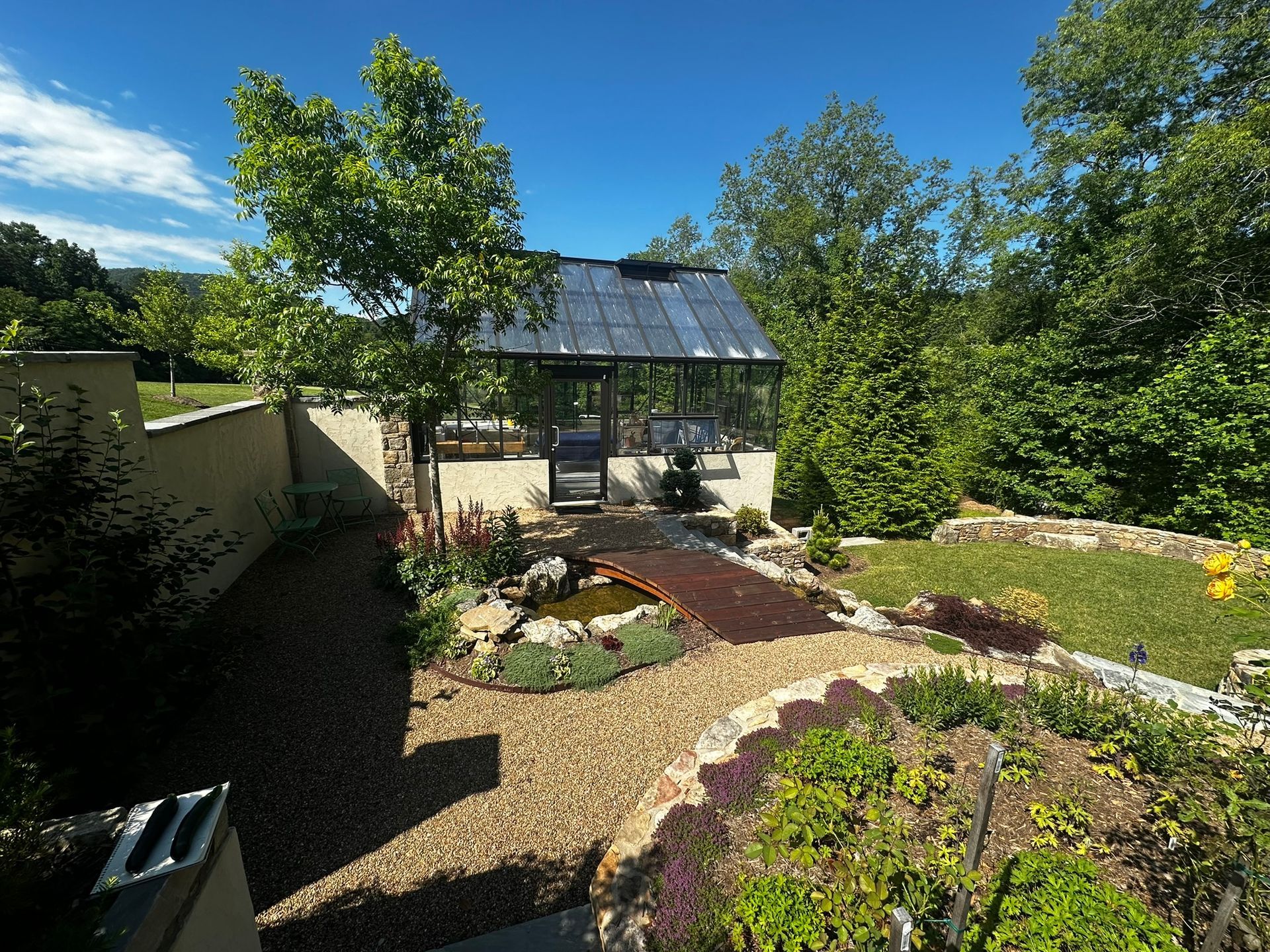 A garden with a gazebo in the middle of it.