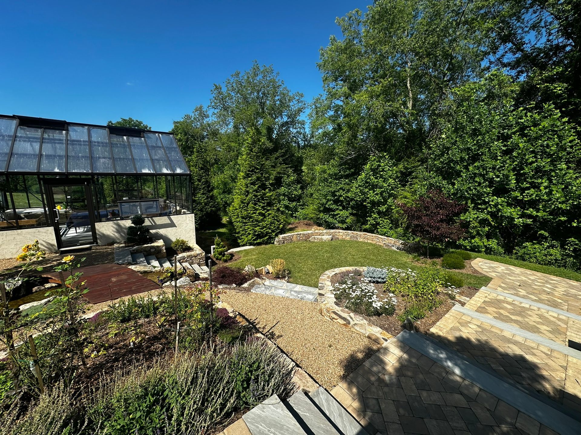 There is a greenhouse in the middle of the garden.