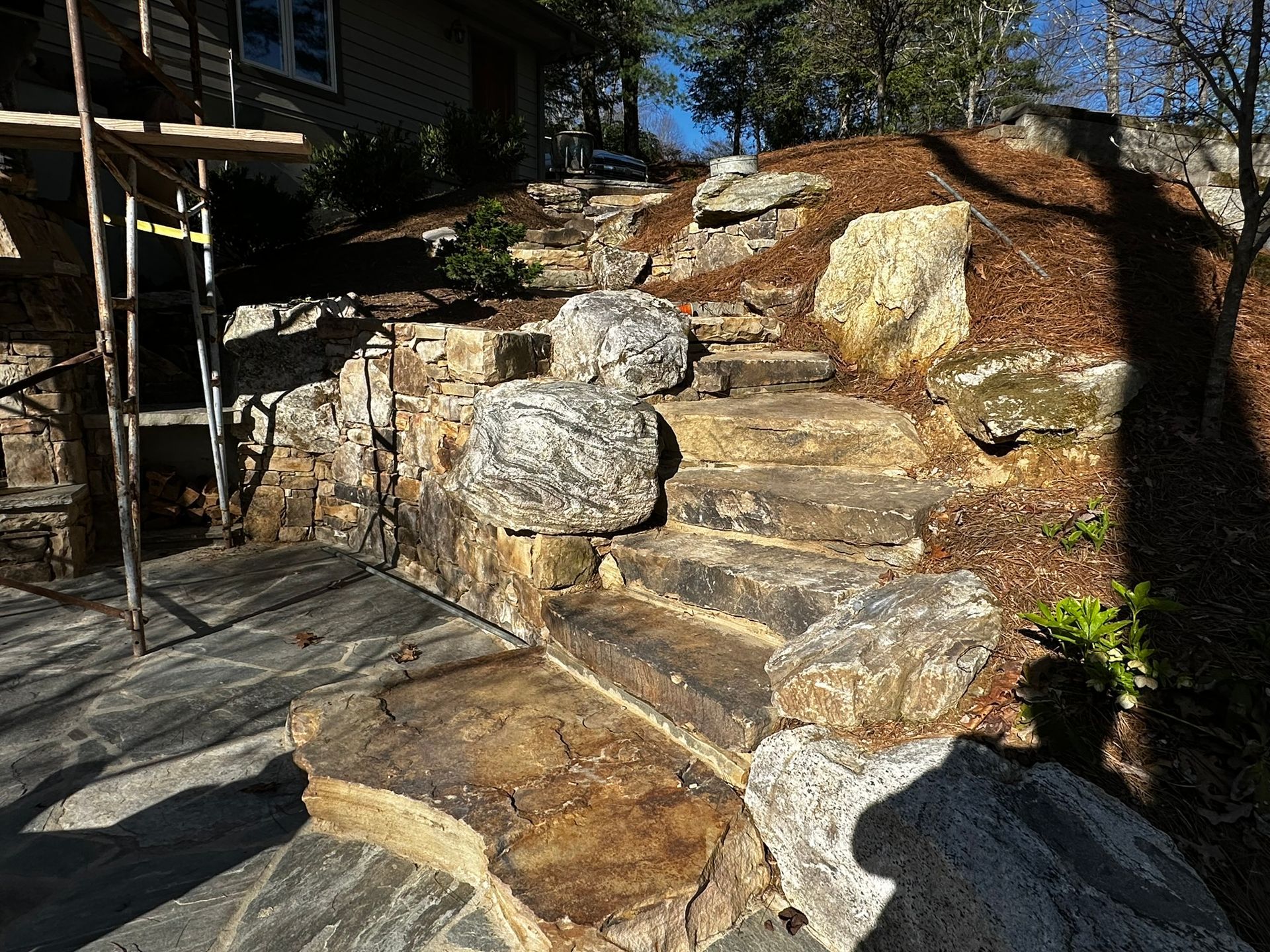 A set of stone stairs leading up to a house.