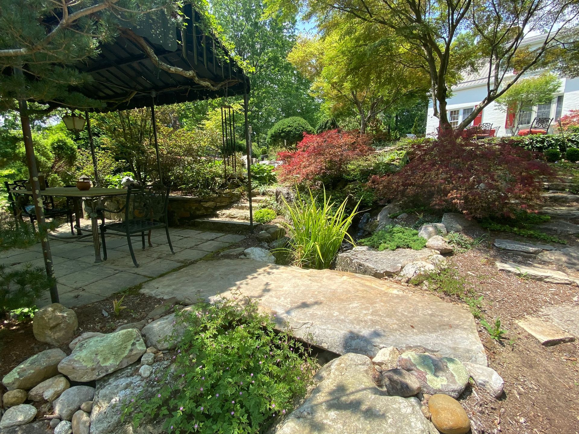 There is a gazebo in the middle of the garden.