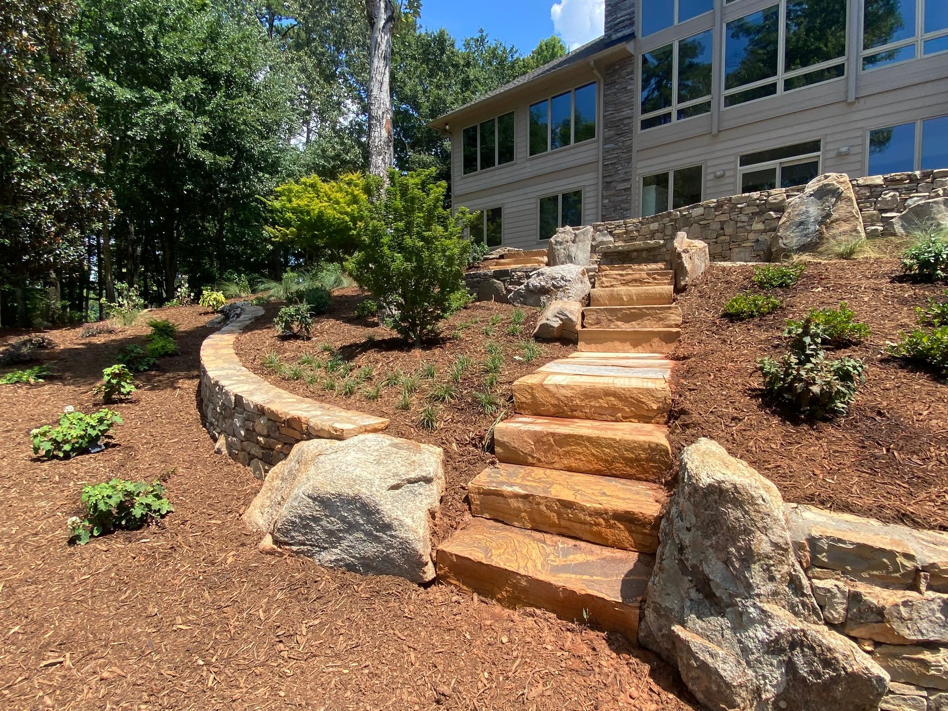 A set of stairs leading up to a large house.