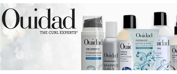 A bunch of bottles of ouidad hair products on a white background