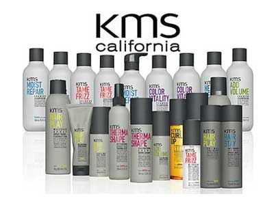 A group of kms california products are lined up on a table