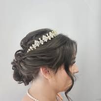 A woman is wearing a tiara in her hair.