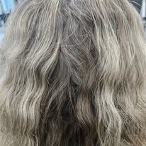 A close up of a woman 's hair in a salon.