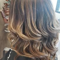A close up of a woman 's hair in a salon.