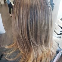 A close up of a woman 's hair in a salon.