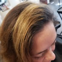 A close up of a woman 's hair in a salon.