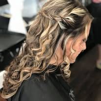 A woman is getting her hair done in a salon.