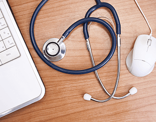 stethoscope and laptop